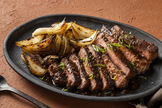 Black Pepper Seared Steak with Scorched Onions