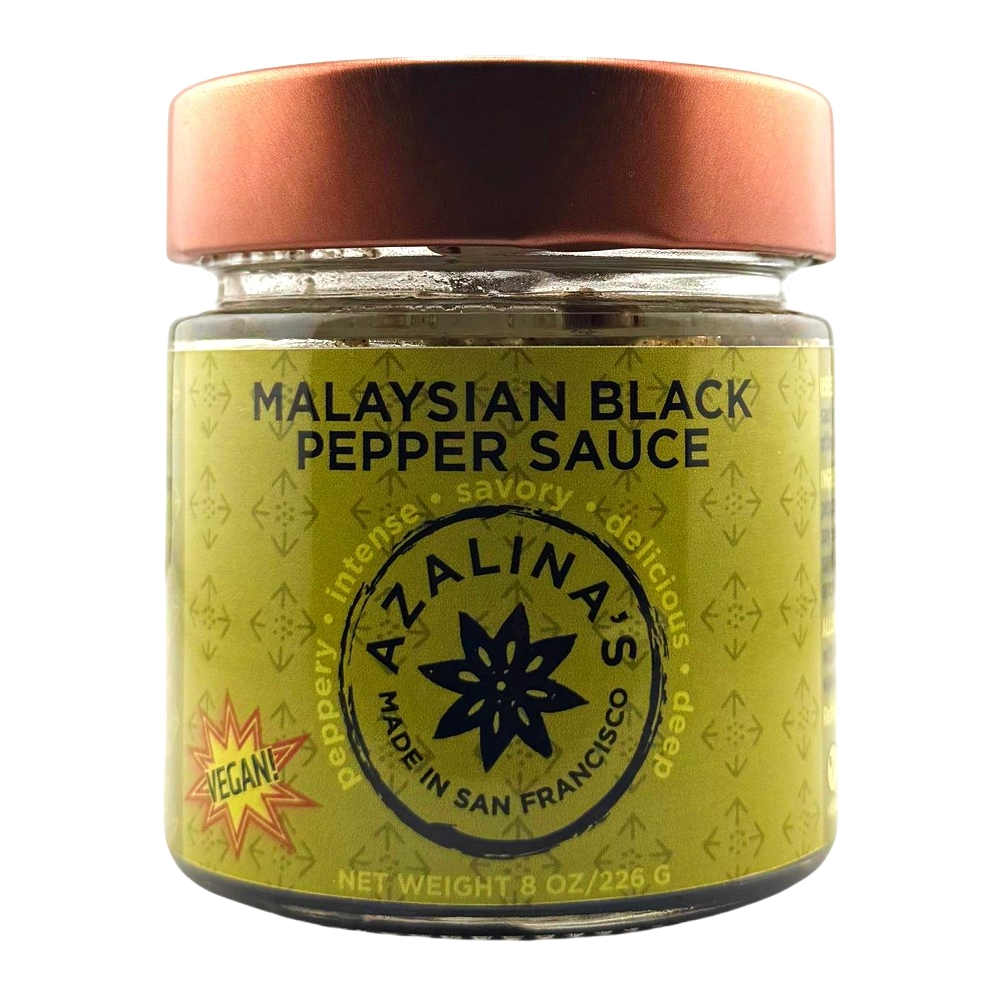 Jar of Malaysian Black Pepper Sauce with a copper lid on a white background
