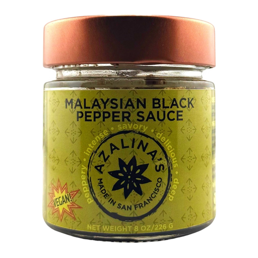 Jar of Malaysian Black Pepper Sauce with a copper lid on a white background
