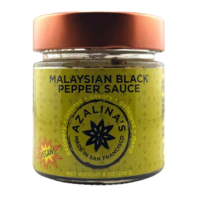 Jar of Malaysian Black Pepper Sauce with a copper lid on a white background