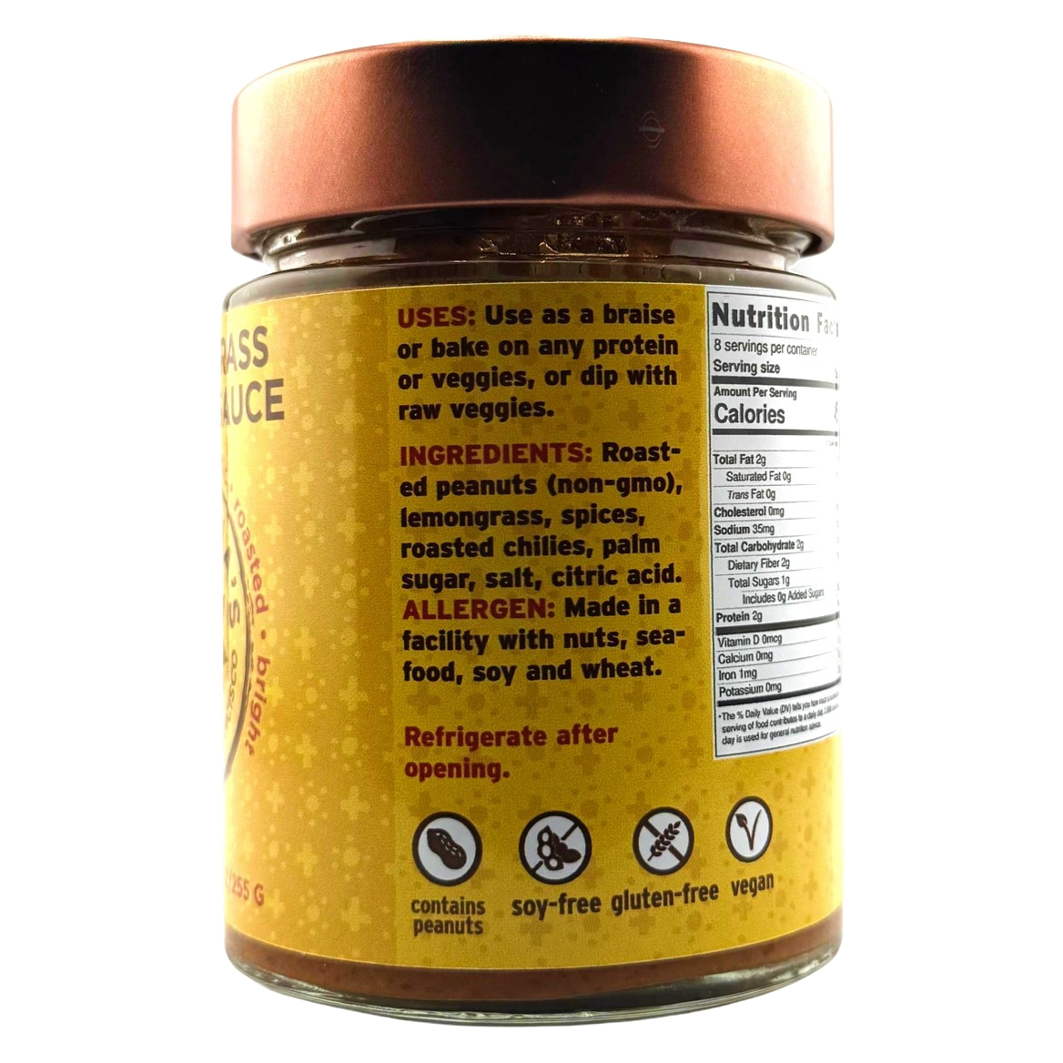 Jar of peanut sauce with a yellow label on a white background
